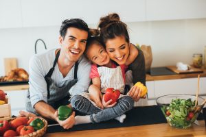 Image of a healthy family in the kitchen making a healthy meal